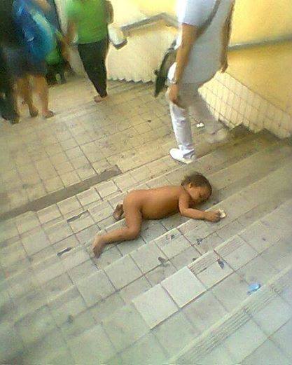 This Child Lies Naked And Helpless On A Stairway Yet No One