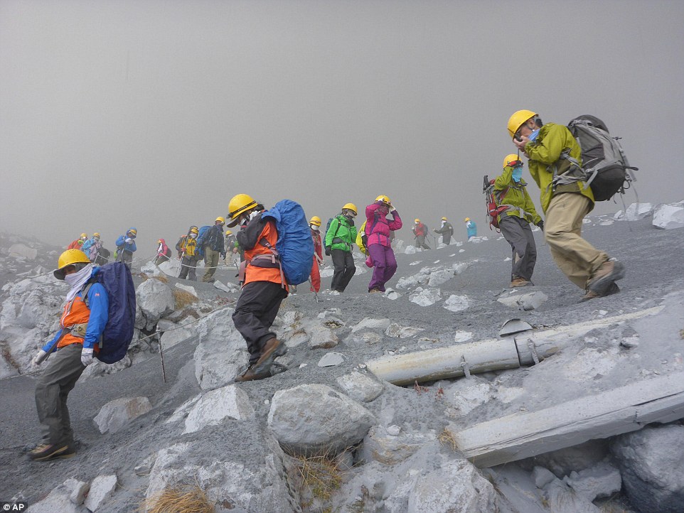 More than 250 people were on the mountain when the volcano started to erupt forcing walkers to improvise protective masks.